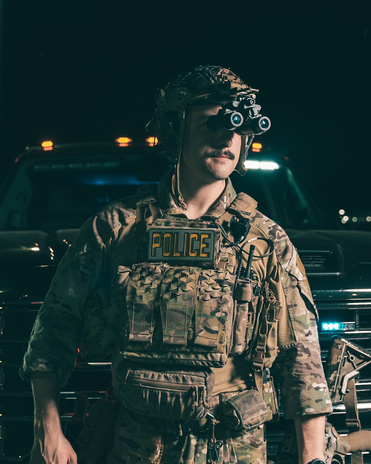 Law enforcement officer using night vision during tactical operation