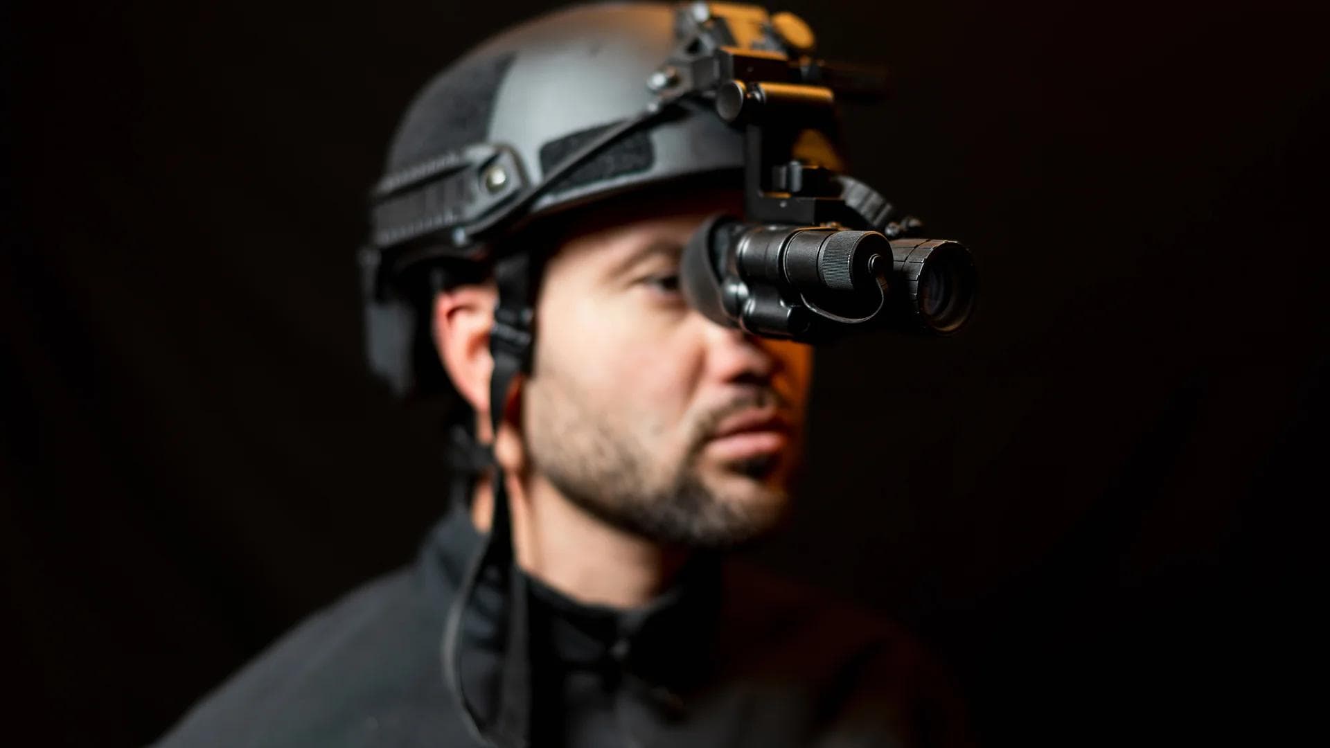 Soldier in tactical military helmet with night vision